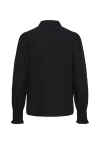 Blouse noire à manches longues avec des poignets smockés, des détails plissés et en dentelle sur les manches, et un col standard, vue de dos.