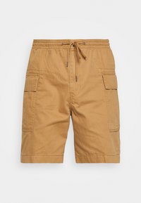 Shorts cargo couleur beige avec une taille élastique, une fermeture à cordon, deux poches cargo latérales, et une texture lisse semblable au coton.