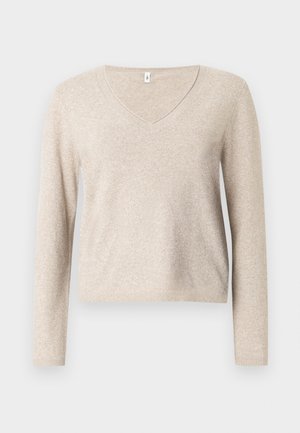 Beige v-neck sweater made of soft knit fabric with long sleeves, featuring a relaxed fit and ribbed hem. Textured surface with slight sheen.