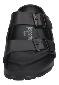 Black slide sandals with two adjustable straps featuring metallic buckles. The sole is textured for grip and comfort. Lightweight and durable material.