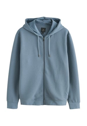 Ljusblå zip-up hoodie med ett strukturerat, diamantmönster, justerbara dragkedjor och ribbade ärmslut och fåll.