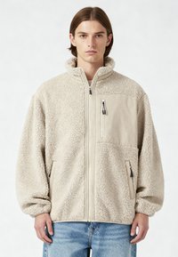 Mira Paris BRUTAL EMBROIDERY UNISEX - Giacca in pile - desert sand