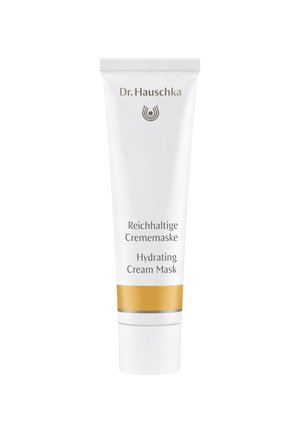 Weißes Kunststoffrohr mit der Aufschrift "Hydrating Cream Mask", einem goldenen horizontalen Streifen und einem grauen Band, das ein Logo oben aufweist.