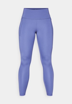 Lilla leggings laget av elastisk materiale, med høyt liv, jevn tekstur og sidelommer for bekvemmelighet.