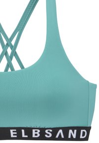 Tyrkysový športový top s hladkou textúrou, ktorý má na chrbte krížový dizajn a čierny pás s nápisom "ELBSAND" bielymi písmenami.