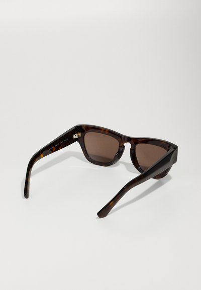 Brown tortoiseshell sunglasses with a rectangular frame, smooth finish, and brown tinted lenses. Features subtly curved arms.