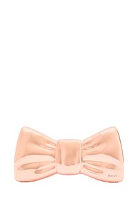 Rosaguld keramisk hårsmycke i form av en rosett med en glansig yta, med en central knut och signaturen "NALI" längst ner.