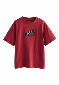 Red cotton T-shirt with a crew neck, short sleeves, featuring an embroidered graphic of a skateboard and "NYC" text on the chest.