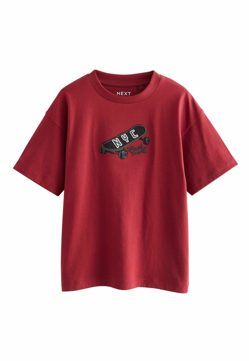 Red cotton T-shirt with a crew neck, short sleeves, featuring an embroidered graphic of a skateboard and "NYC" text on the chest.