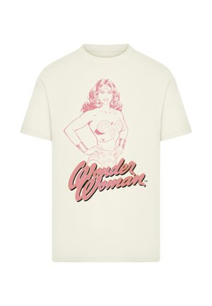 Cremfarbens T-Shirt mit einer pinken Skizze von Wonder Woman, die mit aufgesetzten Händen steht, und dem Text "Wonder Woman" darunter.