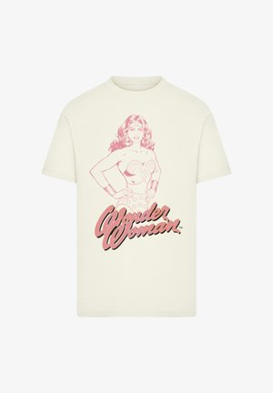 Cream t-shirt featuring a pink sketch of Wonder Woman with hands on hips and "Wonder Woman" text below.