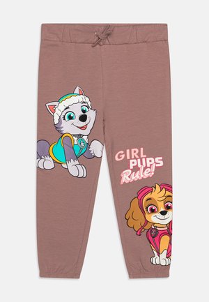 Pantalon de survêtement marron avec des chiens de dessin animé colorés. Taille élastique avec cordon de serrage. Texte sur le côté : "GIRL PUPS Rule !" en rose.