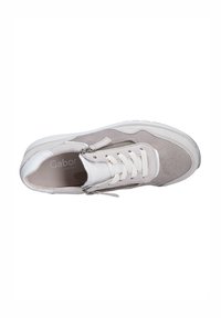 Gray and white sneaker with a suede and leather upper, featuring laces and a side zipper. Thick rubber sole and rounded toe design.