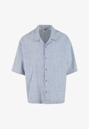 Lühikeste varrukatega helesinine nööbiga särk, millel on tekstuuriga ruuduline muster. Särgil on krae ja ees on viis nööpi.