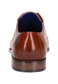 Braunes Lederschuh mit glatter Oberfläche, gepolstertem blauen Innenraum, abgerundeter Zehenpartie und strukturiertem dunkelbraunem Sohlen. Verfügt über ein Logo-Label an der Seite.