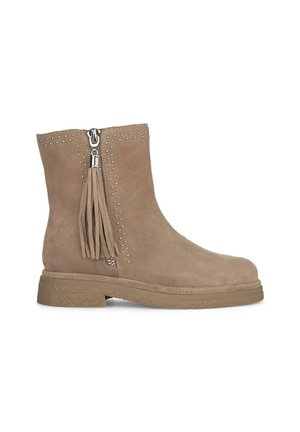 Tan suede ankle boot with side zipper, studs along the top, and a tassel detail. Flat sole with textured rubber for grip.