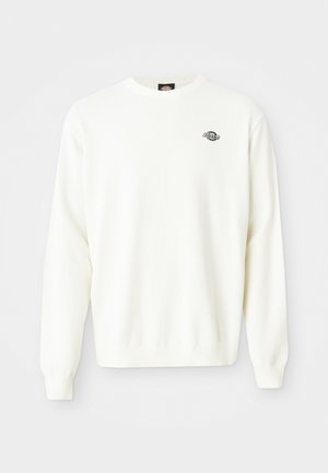 Bela dolgosleeve pletena jopica s krojem vratu in majhnim črnim logotipom Dickies na zgornji levi strani prsnega koša.