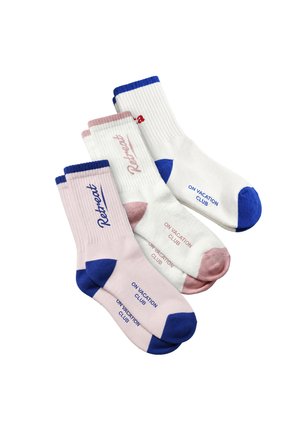 Three pairs of crew socks in white and pink with blue heels and toes, featuring the words "Retreat" and "On Vacation Club" printed on them.