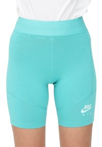 Tyrkysové elastické cyklistické šortky s vysokým pasem, s bílým logem Nike Air na levém stehně a detaily v bočních švech.