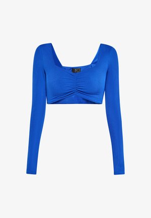 Sinine pikakäsine topp, millel on ruudukujuline kaelus, esitades rüüpeterite detaili ja lühendatud disaini. Valmistatud siledast ja venivast kangast.