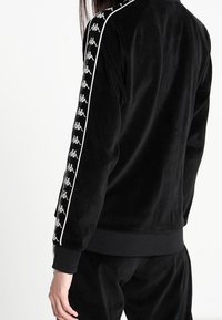 Kappa Felpa con zip - black