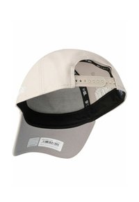 Beige Mütze mit einem gebogenen Schirm, verfügt über ein schwarzes Innenfutter und einen verstellbaren Riemen auf der Rückseite. Das Material scheint aus Baumwolle zu sein.