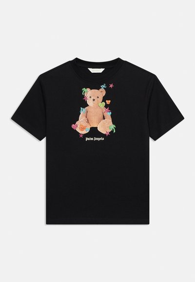 T-shirt noir à manches courtes avec un ours en peluche central entouré d'étoiles colorées, de cœurs et de petites icônes, avec le texte « Palm Angels » en dessous.