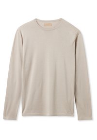 T-shirt beige à manches longues et col rond, au design simple et uni sans motifs ni logos visibles, posé à plat sur fond blanc.