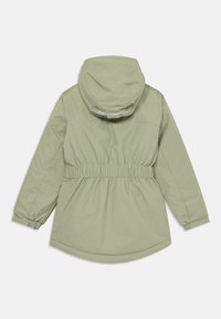 Light green hooded jacket with elastic waist and cuffs, displayed flat with back facing up on white background.
