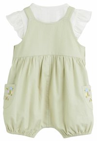 Romper in cotone verde chiaro con maniche a sbuffo, vita arricciata e ricami floreali sulle tasche. Presenta spalline regolabili e fondo arrotondato.