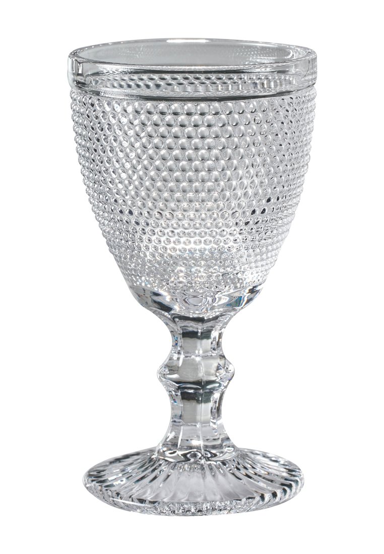 Copa de cristal transparente con puntos texturizados y en relieve, borde acampanado y base con forma de concha. Transparente y suave, con un acabado pulido.