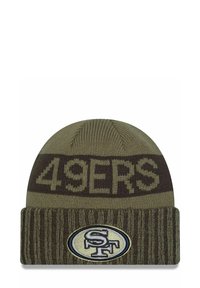 Khaki knitted beanie with brown stripes. Features "49ERS" text and an embroidered oval logo with "SF." Soft texture, fitted design.