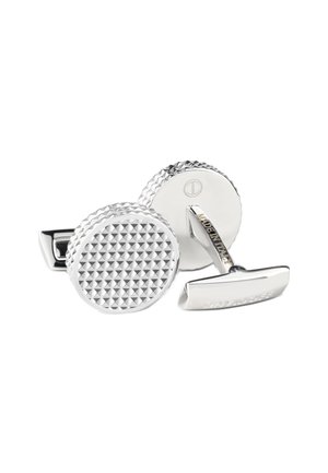Silver-tone cufflinks with a round, textured design featuring small pyramid patterns. The back displays engraved branding. Polished finish.