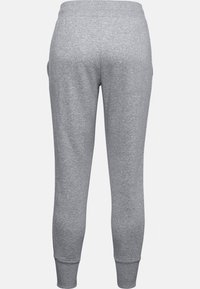 Grå sweatpants med ett mjukt tyg, elastisk midja och smalnande ärmar vid anklarna. Slät yta utan synliga mönster.