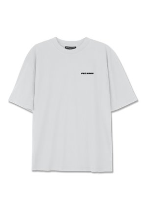 Vaaleanharmaa lyhythihainen t-paita, joka on valmistettu pehmeästä puuvillasta ja jossa on pieni musta "PEGAADOR"-logo vasemmassa rinnassa. Rennonmallinen.