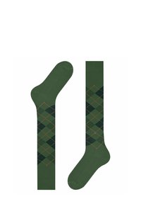 Calze verdi con un motivo argyle a diamante in verde scuro e accenti arancioni. Il materiale è morbido e texturizzato, progettato per il comfort.