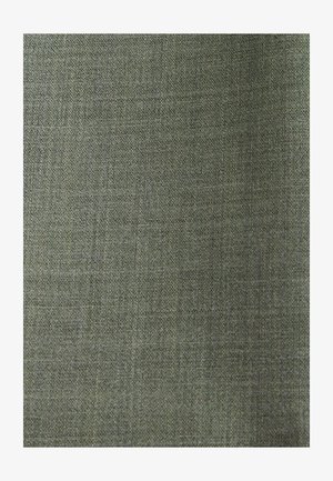 Gros plan d’un tissu à armure toile uni texturé avec des fils entrelacés gris et verts.