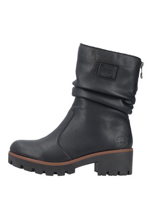 Black leather ankle boot with a slouchy design, textured surface, side zipper, and a chunky rubber sole featuring a tread pattern.
