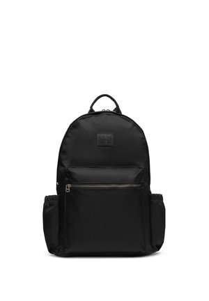 Black backpack with front zip pocket, side elastic pockets, top handle, and brand patch on front panel.