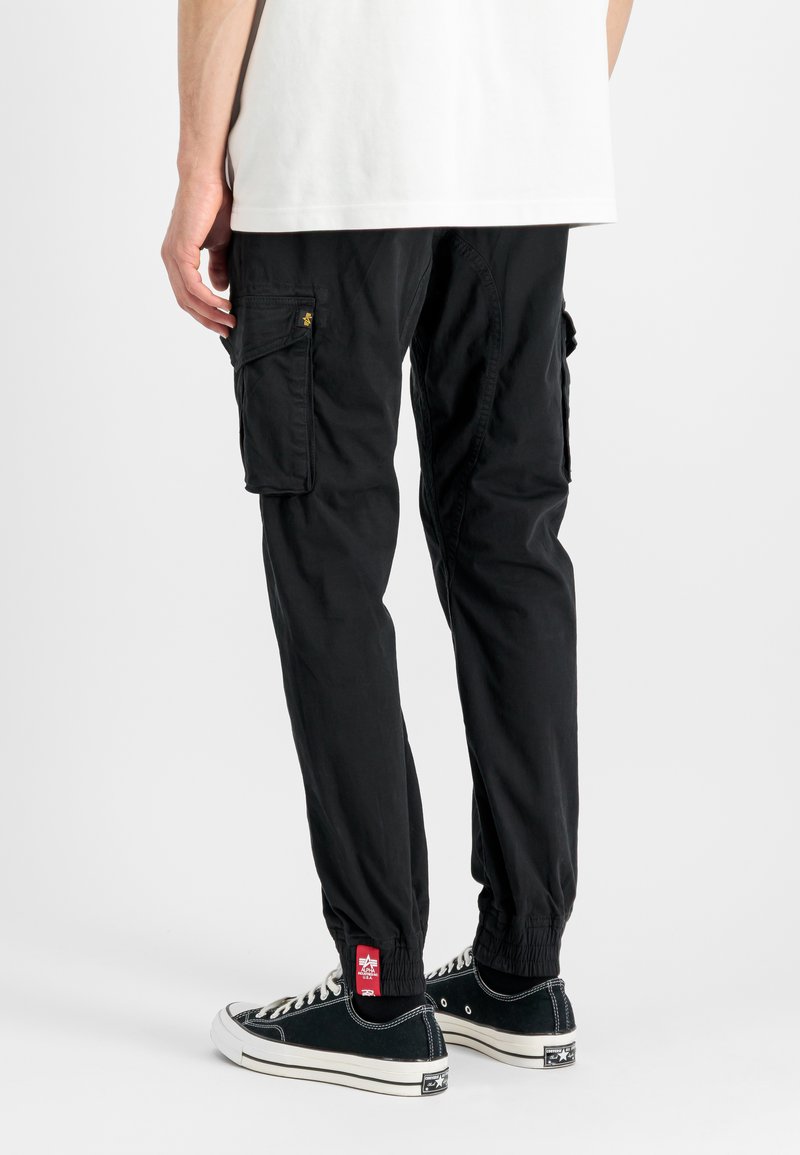 Alpha Industries Hlačami s stranskimi žepi - black