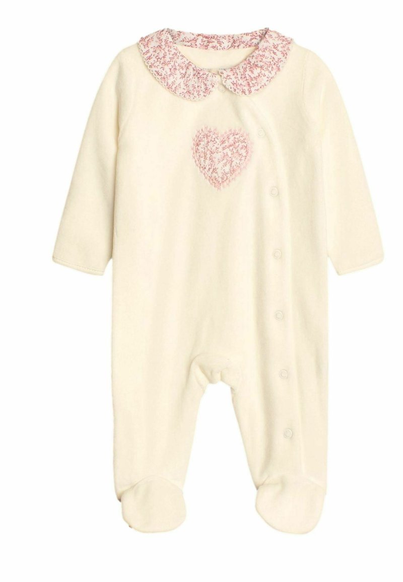 Cremfarbener Overall mit langen Ärmeln, strukturiertem rosa Kragen, Herzdesign auf der Brust, Druckknopfverschluss vorne und Füßchenboden.