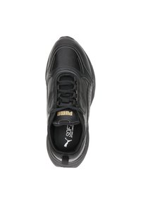 Black sneaker featuring a textured leather upper, lace closure, padded tongue, gold logo accents, and a cushioned sole for comfort.
