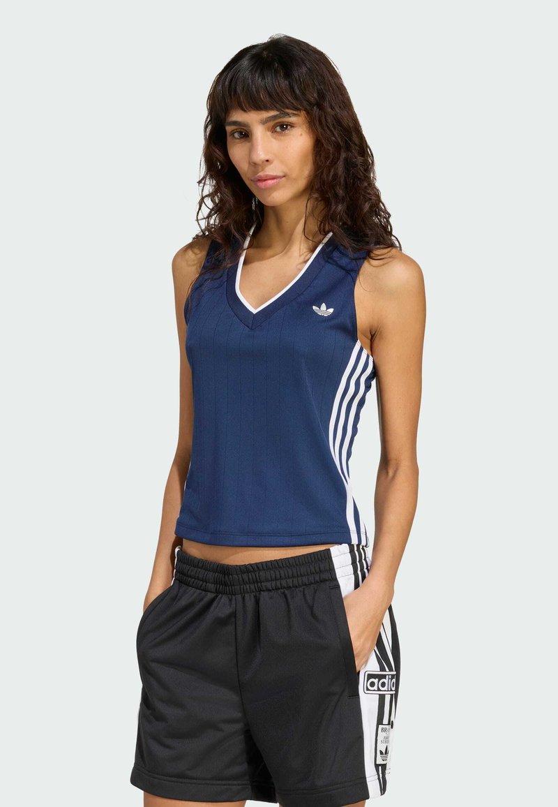 Navy sleeveless top with a ribbed texture, white accents, and three vertical stripes on each side. Paired with black athletic shorts.