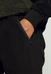 Denim Project PANTS - Calças de fato de treino - black