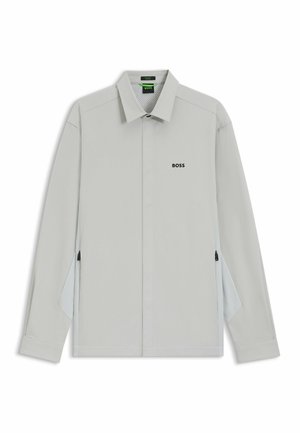 Light gray jacket with a collared neckline. Features a subtle "BOSS" logo, side zippers, and mesh detailing on the inside.