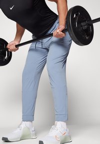 Nike Performance UNLIMITED - Pantalones deportivos - ashen slate/black