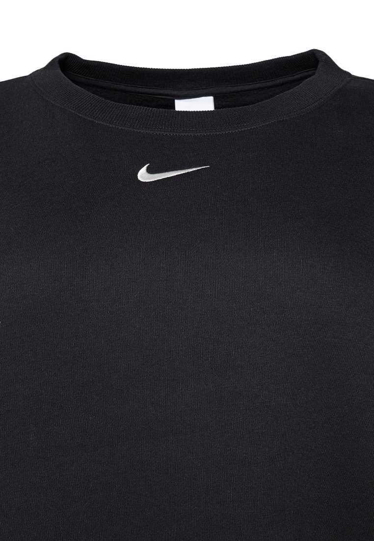 T-shirt noir Nike avec un col rond, des manches courtes et un petit logo argenté sur la poitrine. Fabriqué en tissu lisse et extensible.