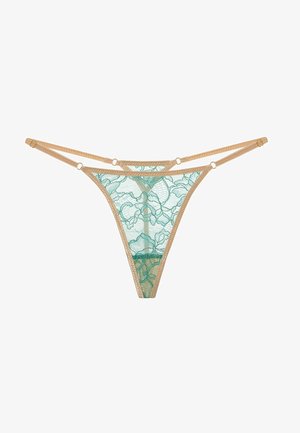 Blonder thong i gennemsigtig teal med blomstermønster, med beige stropper og hardware i guldton. Minimalistisk design med delikate detaljer.