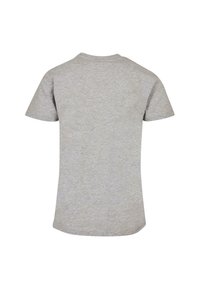 Pilkas trumpa rankovė T-shirt, pagamintas iš minkštos medvilnės mišinio, su klasikine apykakle ir lygiu, tolygiai struktūruotu paviršiumi be raštų.
