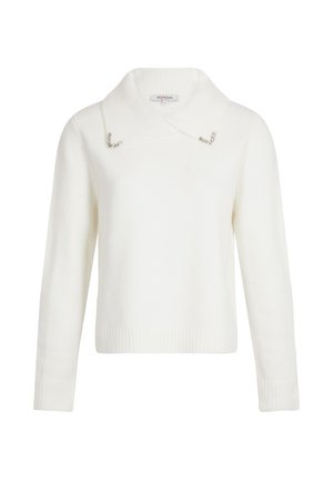 Pull blanc avec un col, présentant des accents en métal argenté au niveau du col. Fabriqué dans un matériau doux avec des poignets et un ourlet côtelés.